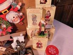 Lot of Christmas Decorations, Paper and Ornaments, Dickens Village Ceramic Candle Holder, 6 Bowling Green Commemorative Ornaments, Approximately 17 Internation Santa Claus Collection with Boxes, Approximately 3 Lenox Collection Ornaments