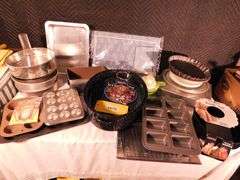 Lot of various baking items, cookie sheets, cake, muffin pans, placemat set, roast pan, chicken can rack