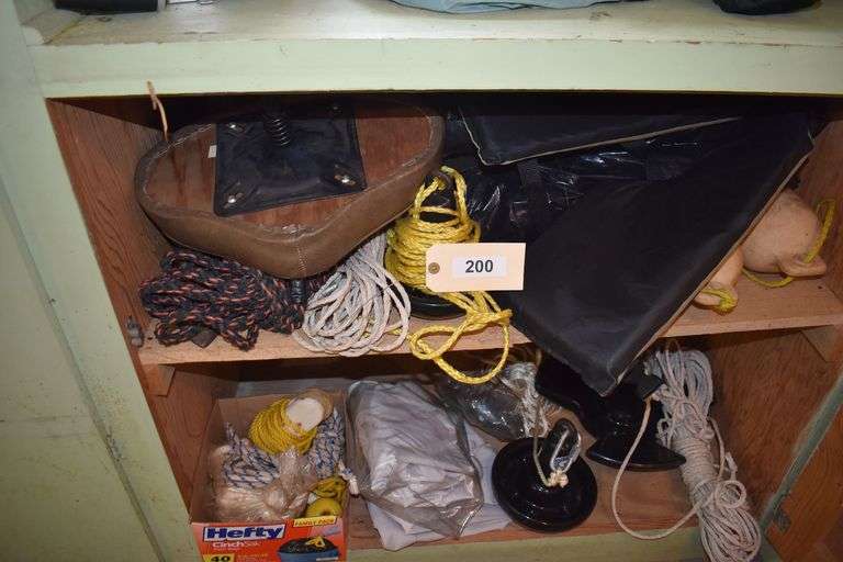 bed roll, nu-way stove, anchors, buoys, life jackets