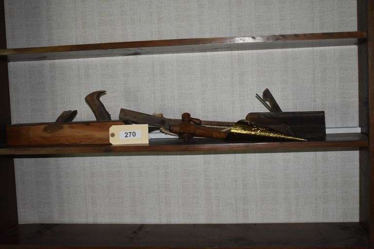 antique hand tools and brass cone