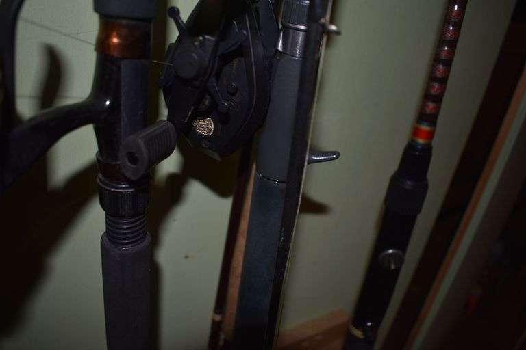 7 various sized fishing poles with reels and string
