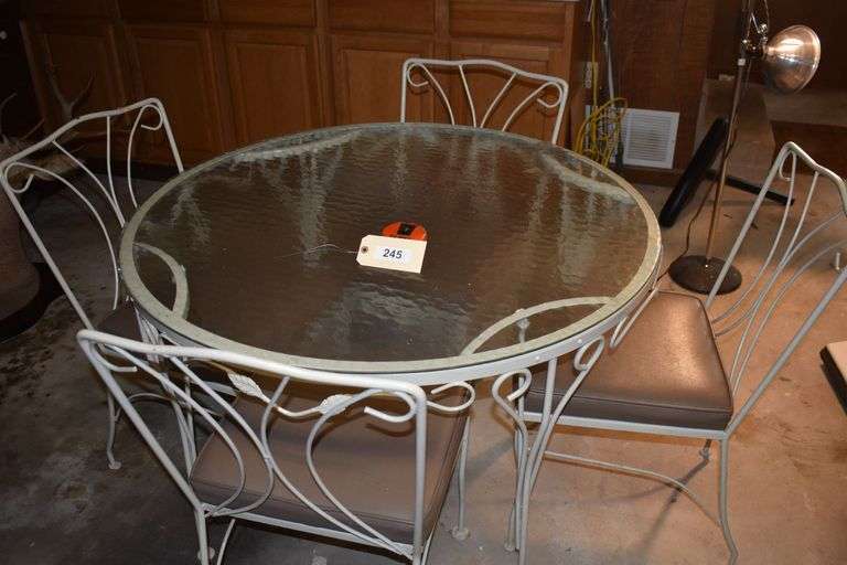 Glass and metal outdoor table with 4 metal chairs