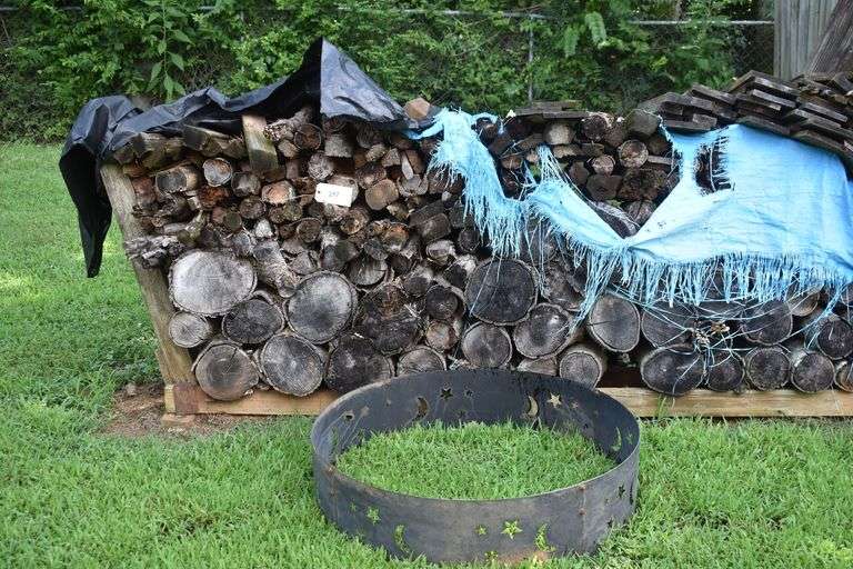 Rick of wood with metal fire ring