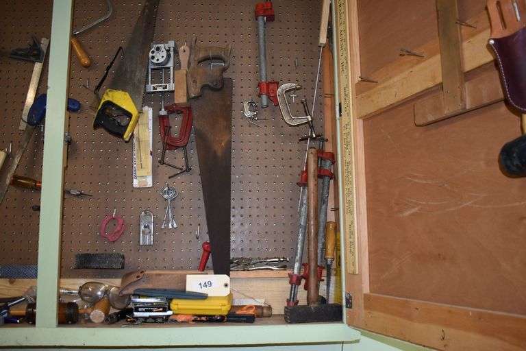 Numerous hand tools, fiels, hand saws, screw drivers, staples, hammers, clamps, chizzels, safety glasses, brushes, picks, rulers, etc.