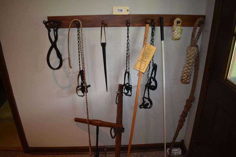 Vintage animal traps, ice block grabber, walking sticks, bull whip and metal pick