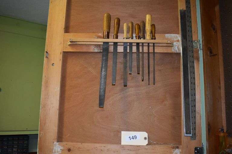 Numerous hand tools, fiels, hand saws, screw drivers, staples, hammers, clamps, chizzels, safety glasses, brushes, picks, rulers, etc.