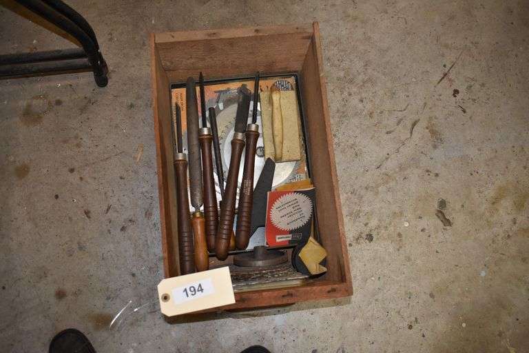 Wood chizzels, saw blades in wooden box