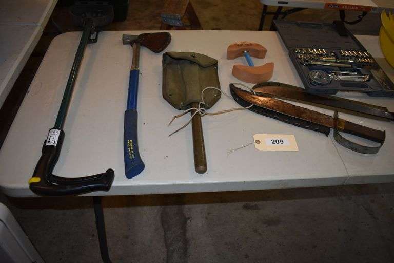 Various implements, axes, maul, sledge hammer, rakes, clamps, crow bar, machete, bowie knife, etc.