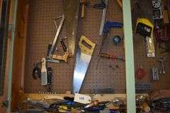 Numerous hand tools, fiels, hand saws, screw drivers, staples, hammers, clamps, chizzels, safety glasses, brushes, picks, rulers, etc.