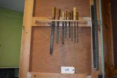 Numerous hand tools, fiels, hand saws, screw drivers, staples, hammers, clamps, chizzels, safety glasses, brushes, picks, rulers, etc.