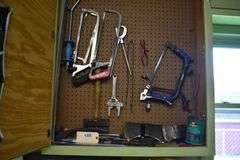 hand tools, contractor bags, welding goggles, sprayer, buckets, chain