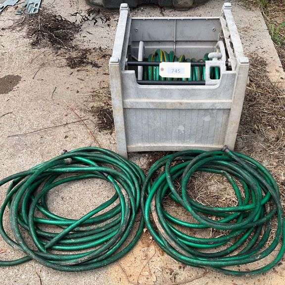 Three Garden Hoses And Hose Crank Caddy image