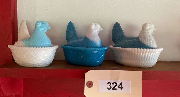 Three White And Blue Glass Hens On Nest image
