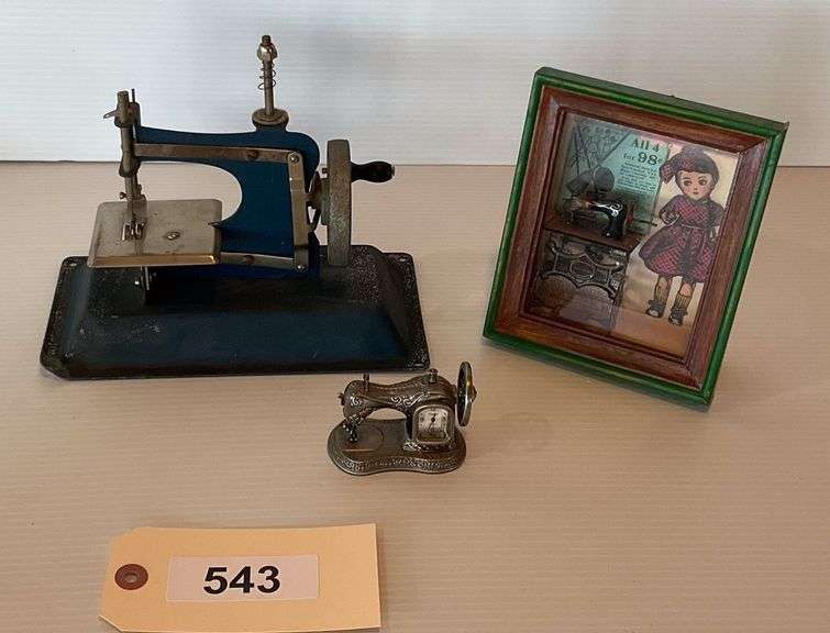 Mini Metal Sewing Sewing Machine Clock, Metal Replica Of A Sewing Machine, Shadow Box Of Small Sewing Machine And Old Advertisement image
