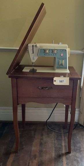 Vintage SINGER Sewing Machine In Cabinet image
