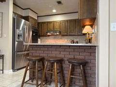 Solid Brick Home on 1.29 +/- Acres, Screened Porch, Workshop, Tree-lined Drive & Outbuildings