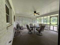 Solid Brick Home on 1.29 +/- Acres, Screened Porch, Workshop, Tree-lined Drive & Outbuildings