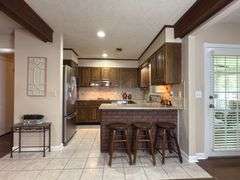 Solid Brick Home on 1.29 +/- Acres, Screened Porch, Workshop, Tree-lined Drive & Outbuildings