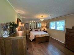 Solid Brick Home on 1.29 +/- Acres, Screened Porch, Workshop, Tree-lined Drive & Outbuildings