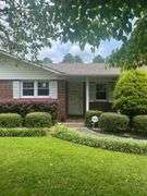 Solid Brick Home on 1.29 +/- Acres, Screened Porch, Workshop, Tree-lined Drive & Outbuildings