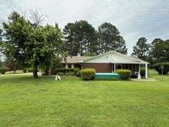 Solid Brick Home on 1.29 +/- Acres, Screened Porch, Workshop, Tree-lined Drive & Outbuildings