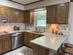 Solid Brick Home on 1.29 +/- Acres, Screened Porch, Workshop, Tree-lined Drive & Outbuildings