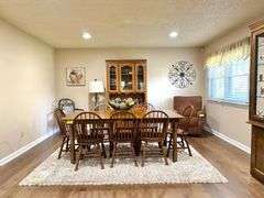 Solid Brick Home on 1.29 +/- Acres, Screened Porch, Workshop, Tree-lined Drive & Outbuildings