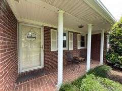 Solid Brick Home on 1.29 +/- Acres, Screened Porch, Workshop, Tree-lined Drive & Outbuildings