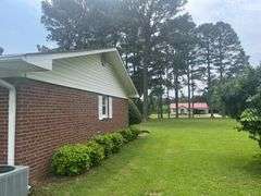 Solid Brick Home on 1.29 +/- Acres, Screened Porch, Workshop, Tree-lined Drive & Outbuildings