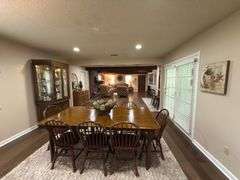Solid Brick Home on 1.29 +/- Acres, Screened Porch, Workshop, Tree-lined Drive & Outbuildings