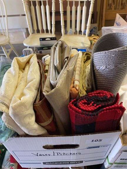 3 boxes linens, table ironing board image