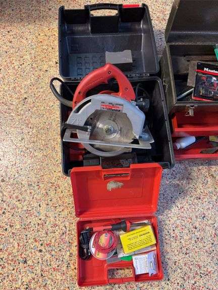 Milwaukee circular saw in case, Weller soldering kit image