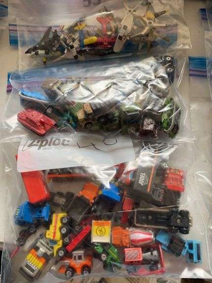 Mini construction trucks and military trucks and planes image