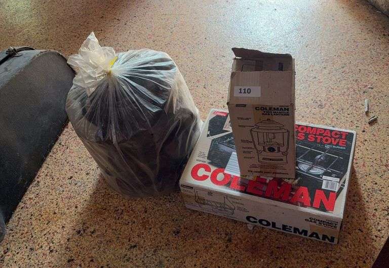 Coleman stove, lantern, sleeping bag image
