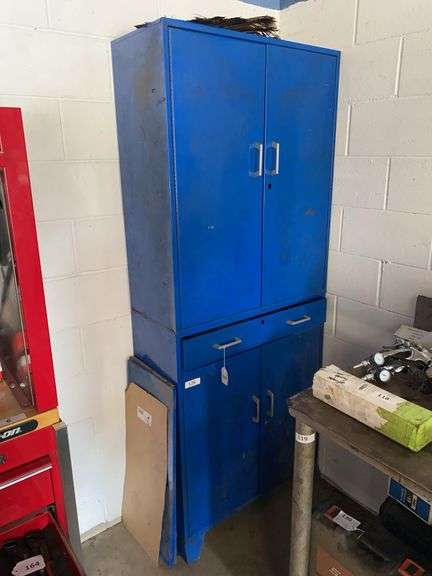 Blue metal cabinet 4 doors, 1 drawer, lower doors lock, 32”w x 14”d x 79”h, excludes all contents image