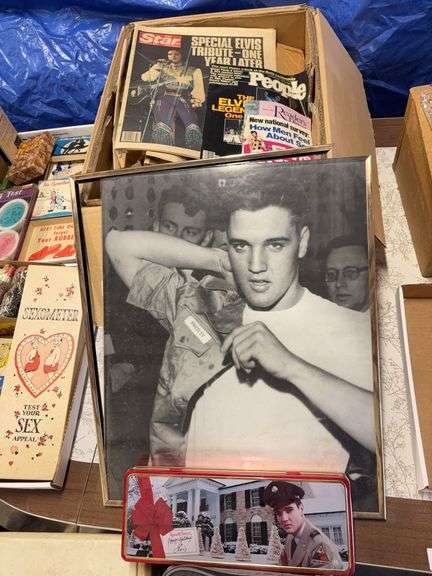 Box of Elvis newspaper clippings, poster , tin image