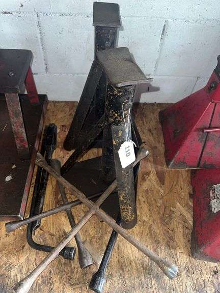 Pair of jack stands, 4 way lug wrenches, rolling mechanics stool image