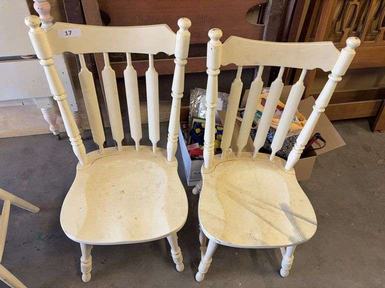 2 white dining chairs