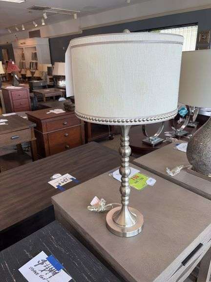 STEIN WORLD BRUSHED NICKLE LAMP WITH OFF WHITE SHADE WITH TAC TRIM AND SILVER MARBLED ROUND URN STYLED LAMP WITH CREAM SHADE image