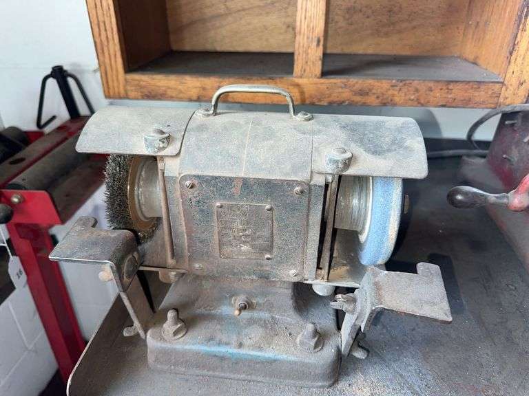 Cincinnati double end grinder with metal cabinet and contents image