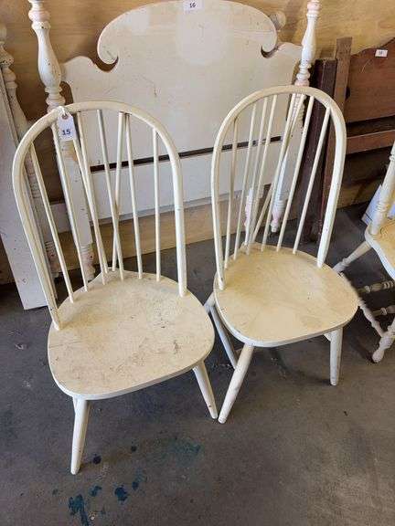 2 white spindle back chairs