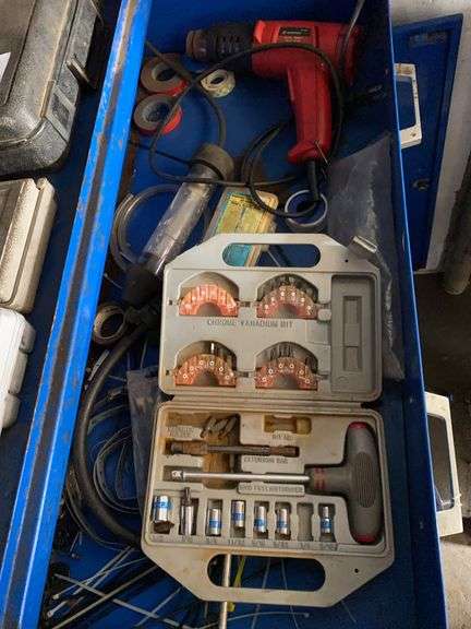 Contents of drawer in blue cabinet, dual temp heat gun, extension driver set image