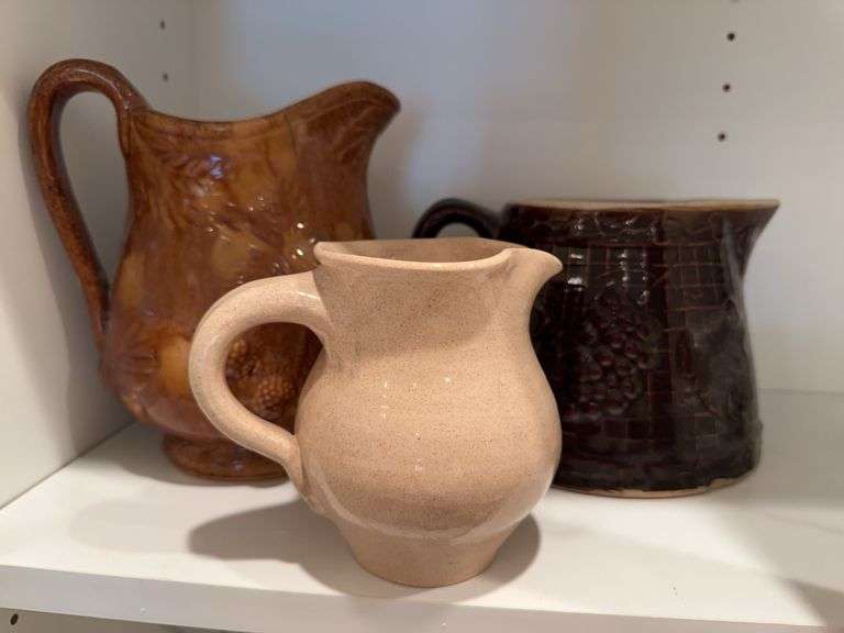 Brown glaze pottery pitcher, leaf pottery pitcher (cracked), small pottery pitcher image