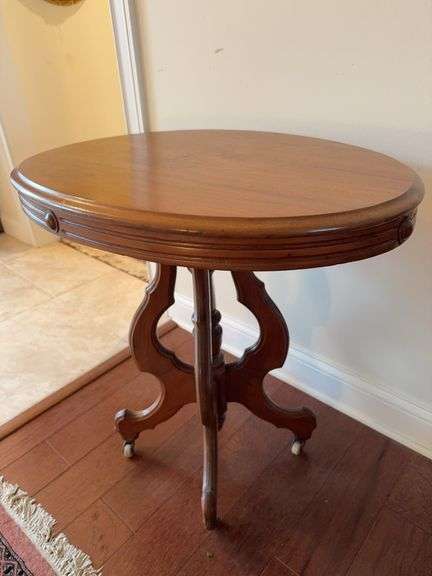 Antique walnut oval pedestal table on rollers 30" x 29" x 21" image