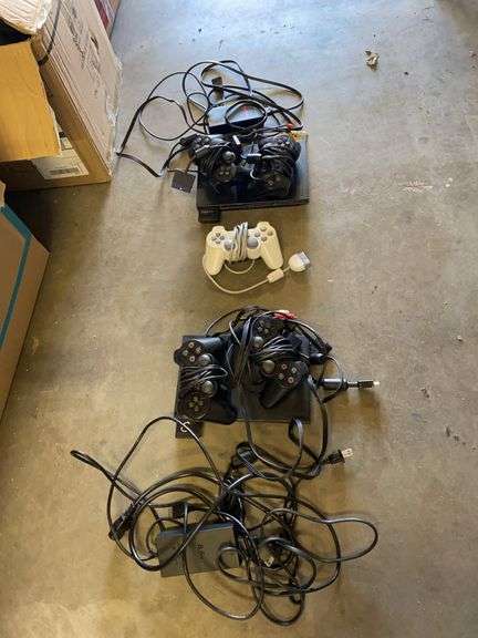 2 SONY play station 2 units with 5 controllers image