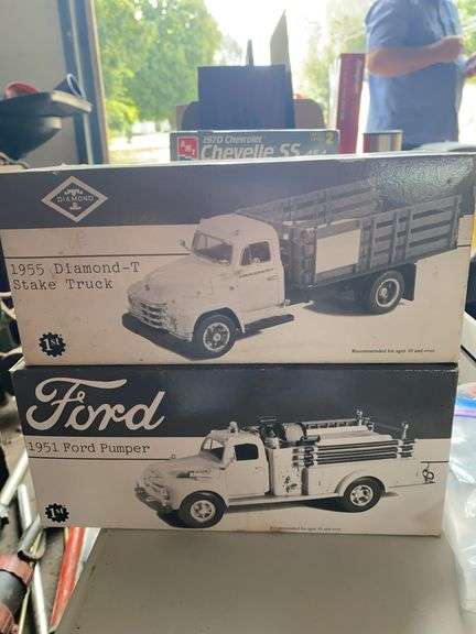 2 model trucks in original boxes, 1951 Ford Pumper, 1955 Diamond-T Stake Truck image