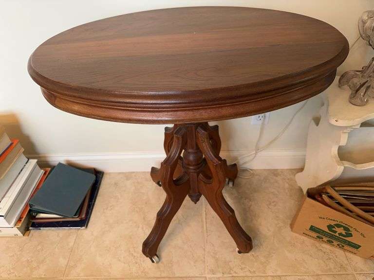 Antique victorian walnut side table on porcelain casters image
