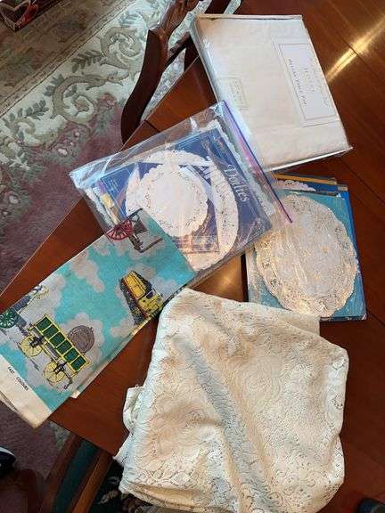 Lace tablecloth, linen towel with trains, paper dollie’s, table pad, woven rug image