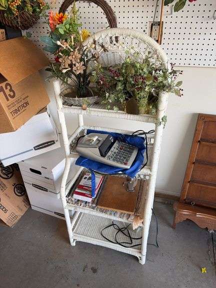 Wicker stand w/ adding machine, floral arrangements, vintage pencil sharpener image