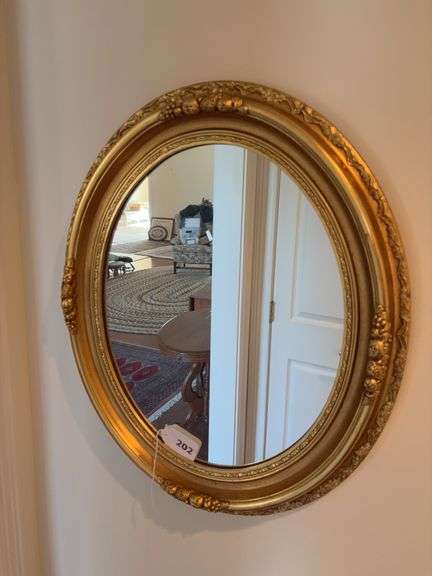 Gold tone ornate mirror image